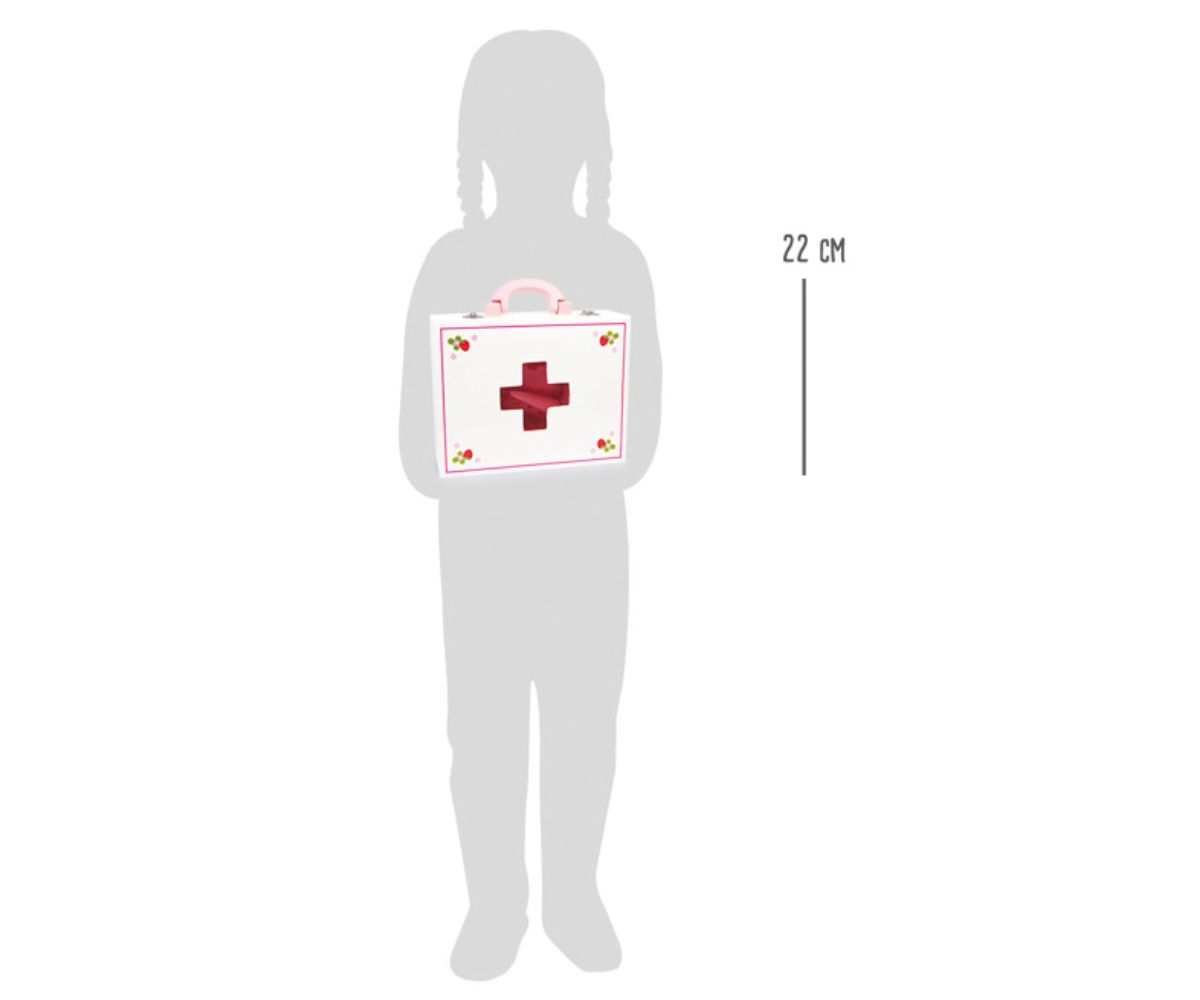 Lapsesõbralikud puidust meditsiinitarvikud roosas komplektis lähivõttena.