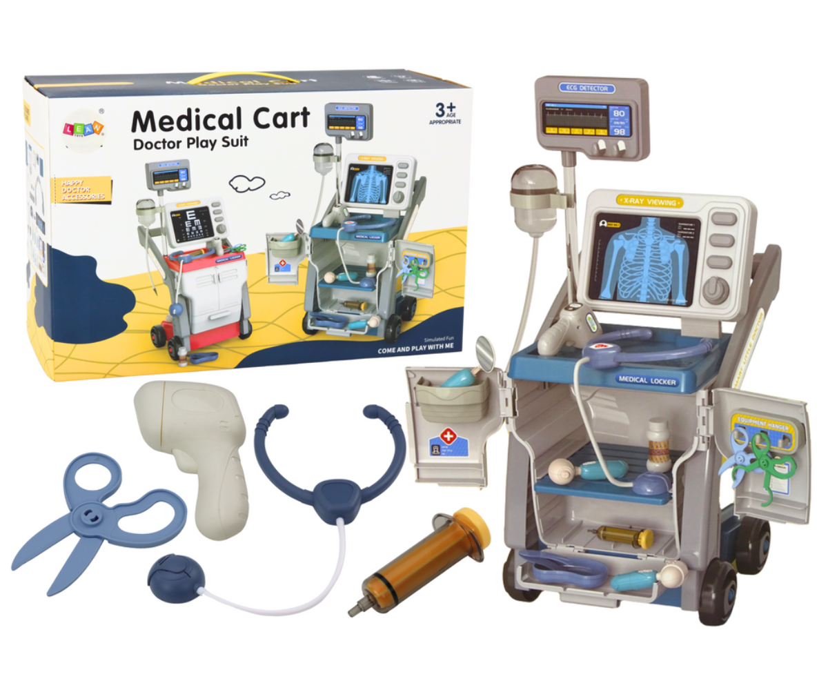 Arstimängu röntgenkäru sinistes toonides koos stetoskoobi ja meditsiinitarvikutega.