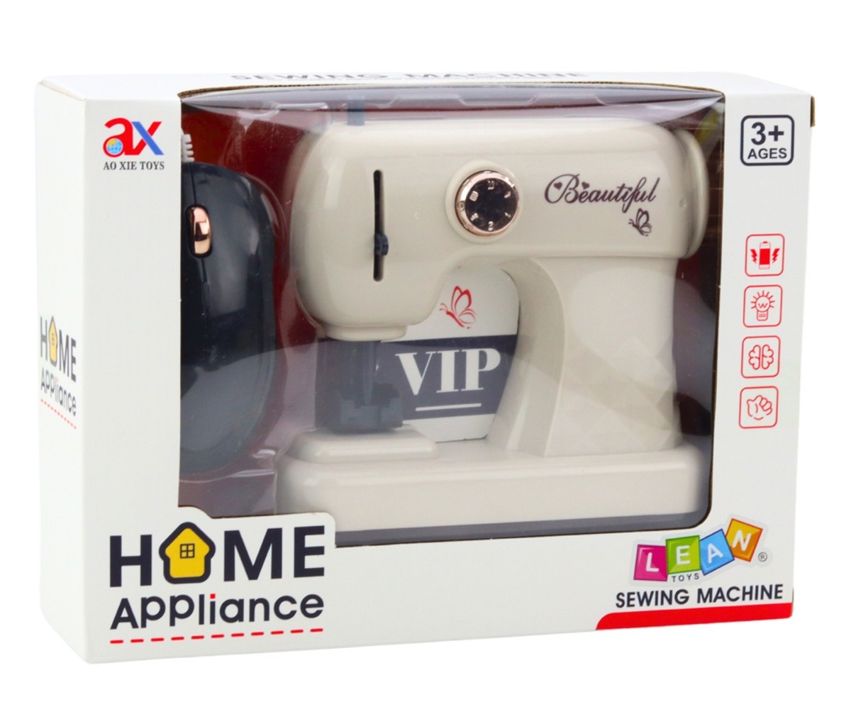 Mänguõmblusmasin hiirega – valgus- ja heliefektidega, pakendi avamise vaade.