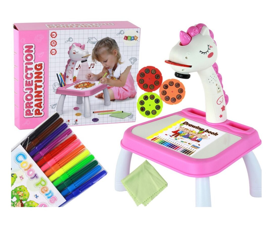 Laste joonistusprojektor jalgadel Ükssarvikuga, laps joonistab peintud laual