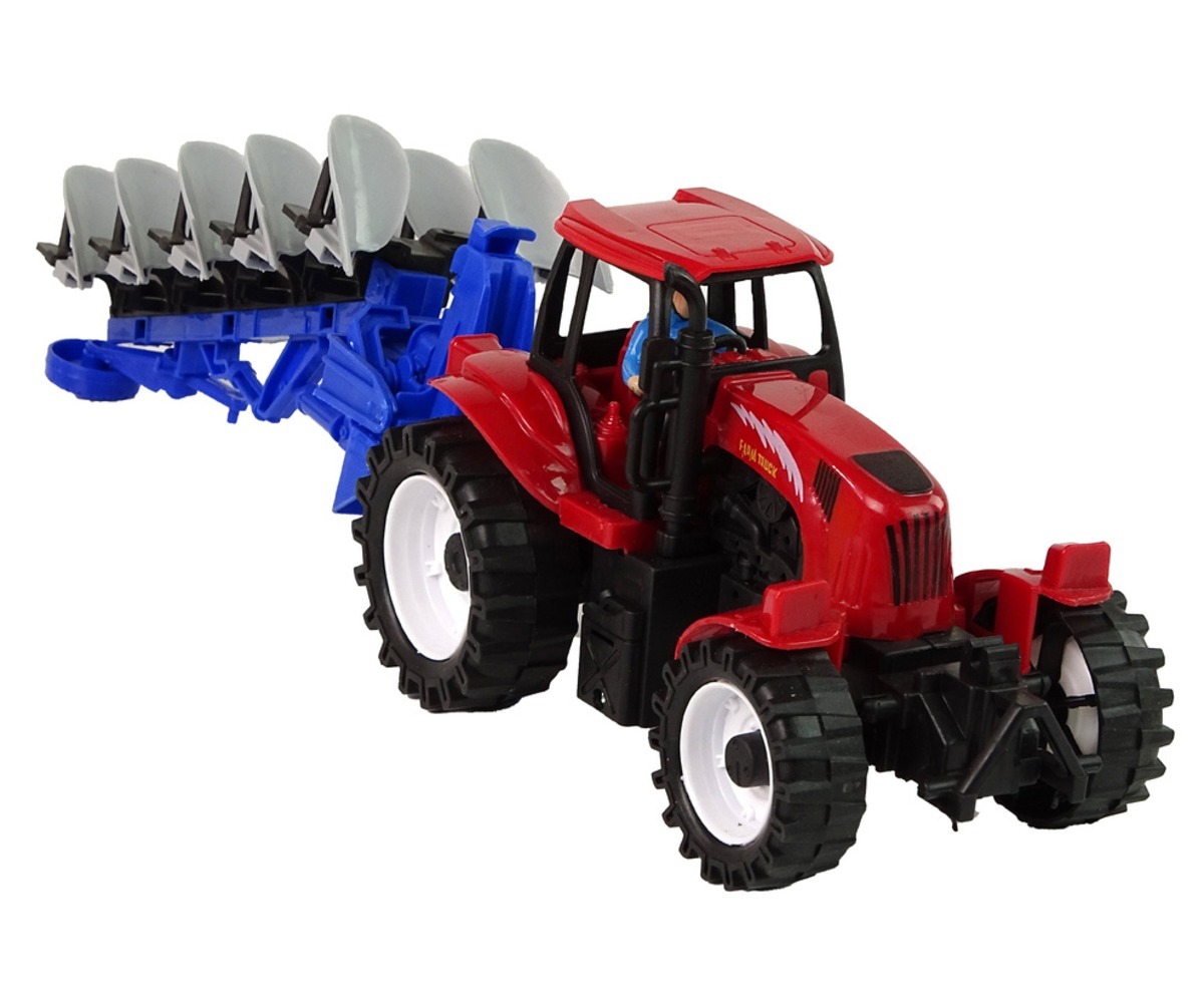 Traktor koos adraga – punane, küljelt vaade, näitab detailset ehitust.