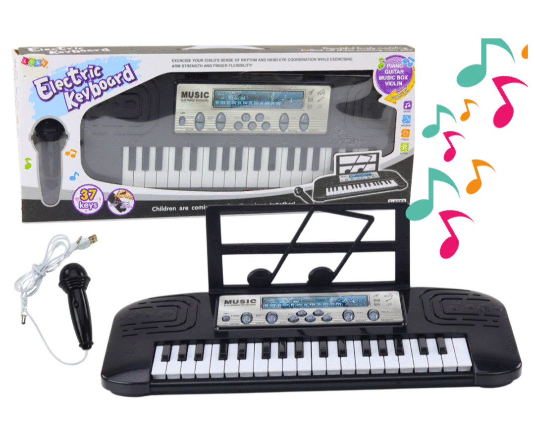 Must laste süntesaator mikrofoniga laual koos noodihoidjaga.