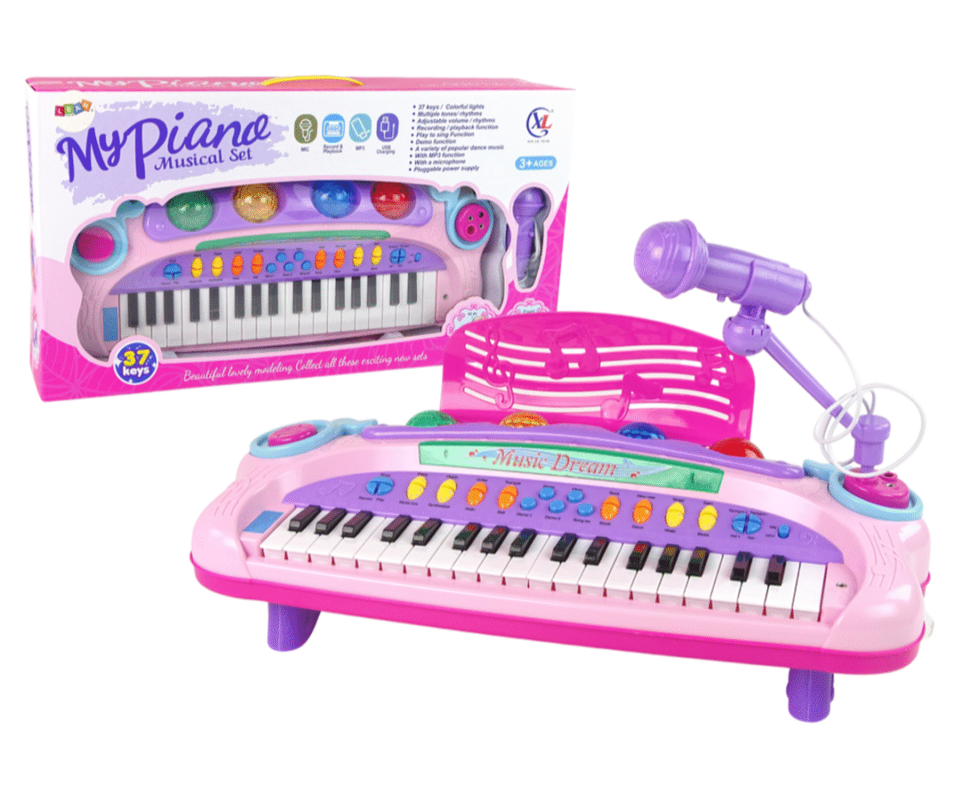 Roosa laste süntesaator koos mikrofoniga laual.