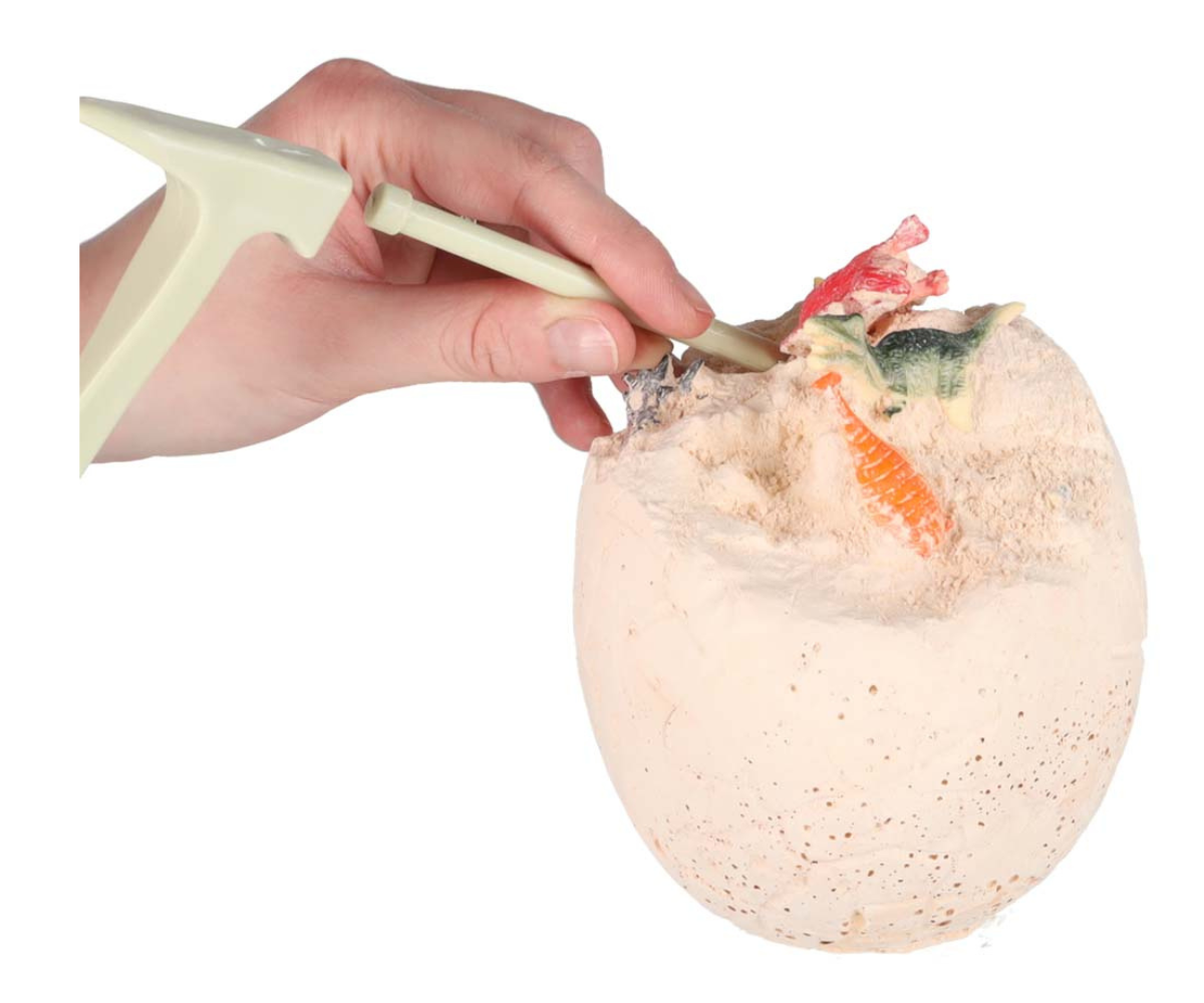 Kipsist dinosaurusmuna, mille sees peitub 12 miniatuursest figuurist koosnev kollektsioon.