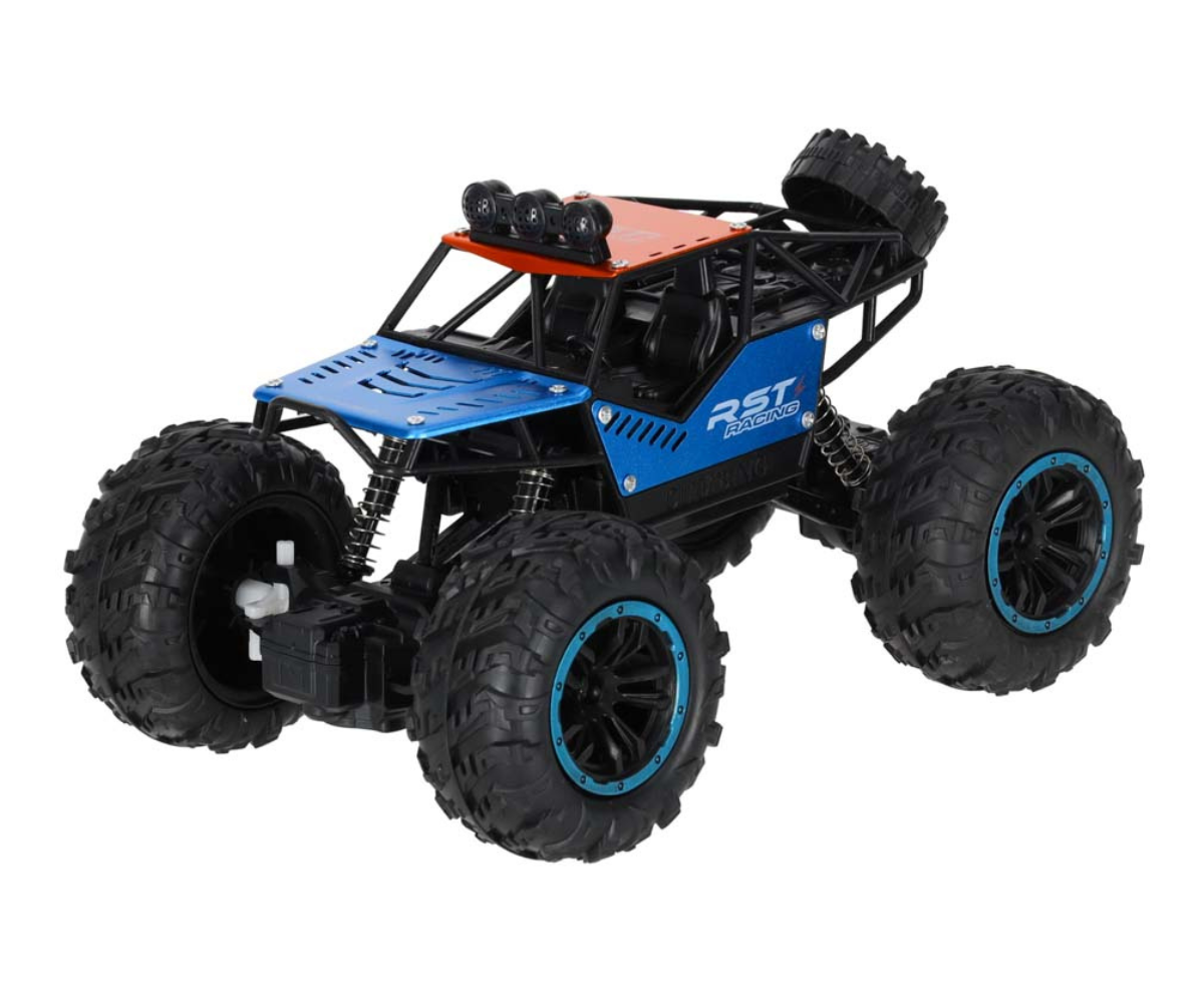 RC maastikuauto ronimas üle väikese kivi ja muru.