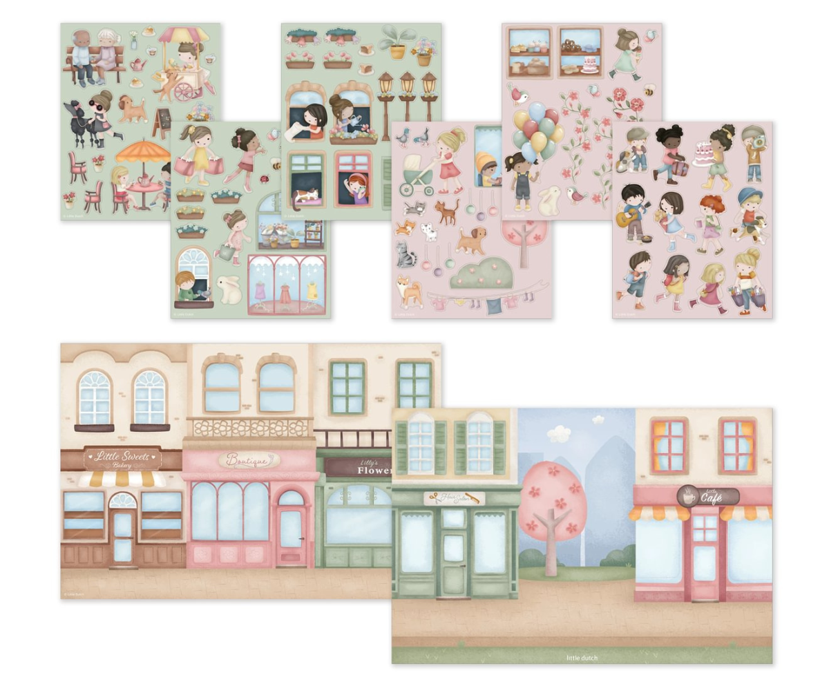 Laps mängimas Little Dutch Rosa & Friends kleepsuvihikuga laua taga