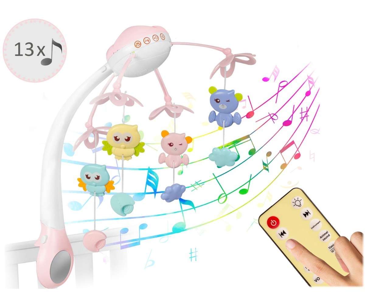 Beebikarussell roosa LED-valgusega töötamas pimedas toas.