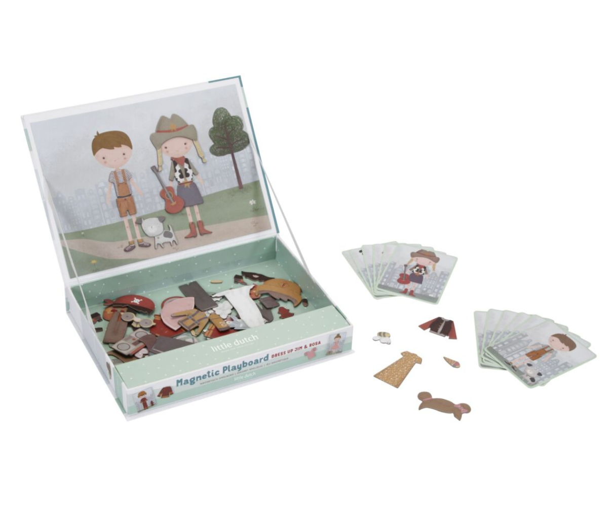 80 värvilist magnetdetaili ja 12 riietuskaarti laiali asetatuna.