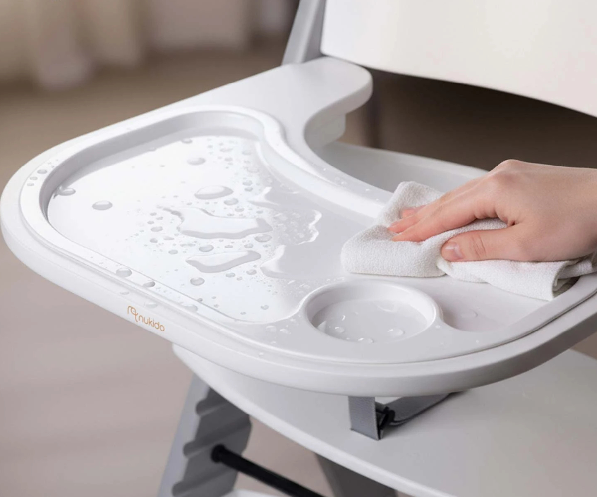 Nukido Nelo tool külgvaates, rõhutades reguleeritavat istet ja jalatuge.