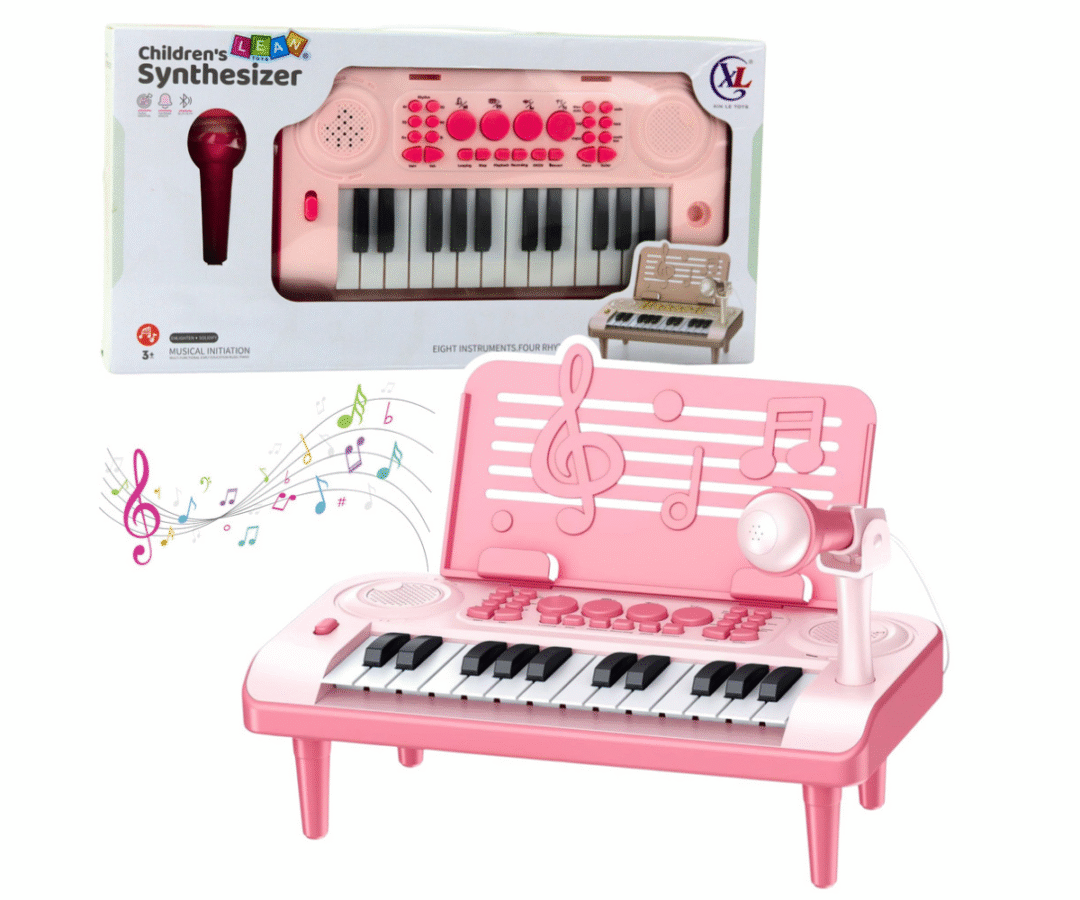 Roosa 24-klahviline laste klaver külgvaates koos mikrofoniga karaoke jaoks.
