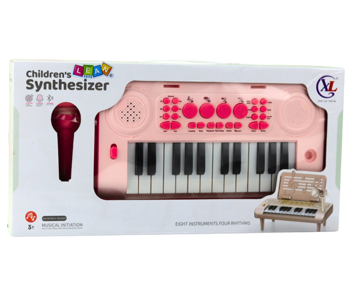 Roosa laste süntesaator 24 klahviga koos mikrofoniga ja noodialusega.