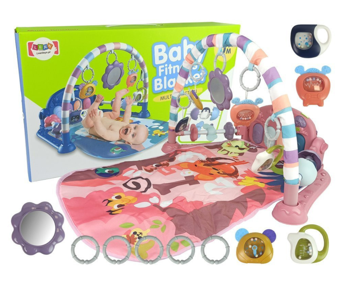 Roosa beebimängumatt pianoga, riputatavate mänguasjade ja peegliga.