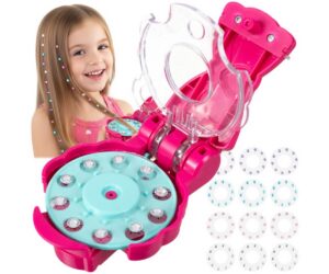 Laps, kes kasutab juuste ja riiete kaunistamise masinat, millel on 180 XXL kristalli