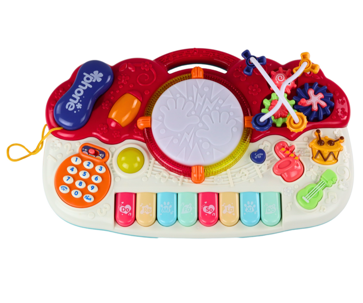 Laste hariv klahvpill trummi - helide ja valgusega seade, millel on klahvid ja trumm.