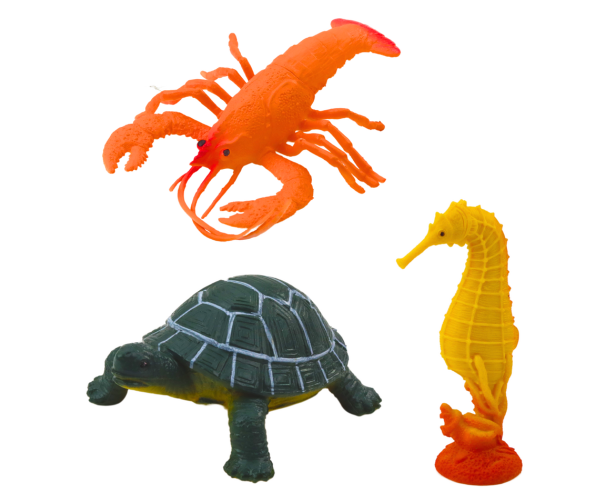 Mõõkvaala, kilpkonna ja merihobuse mängufiguurid.