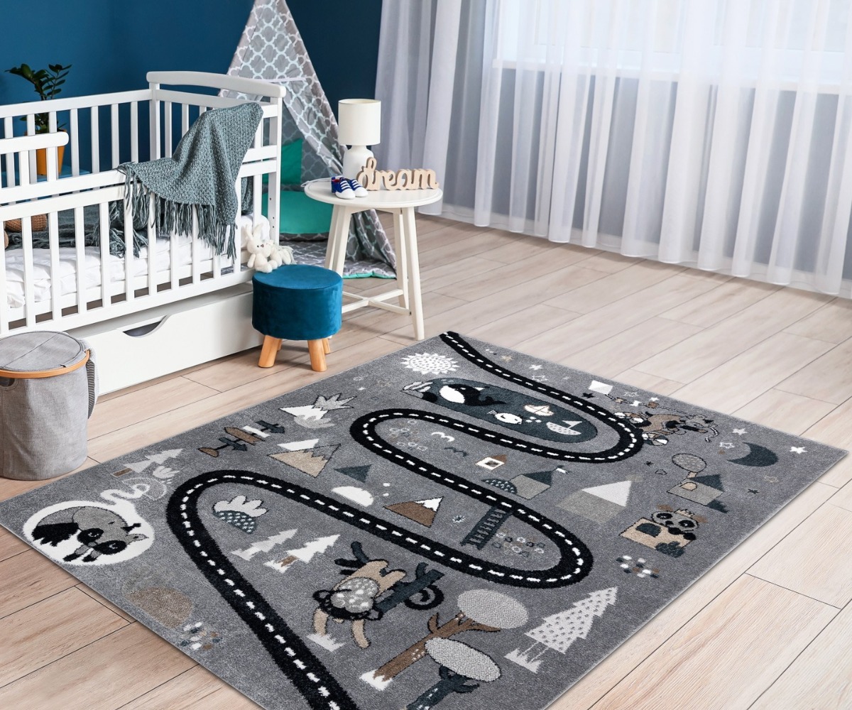 Lastetoa autovaip FUN Autotee hall magamistoas, lisades sooja ja mängulise elementi.