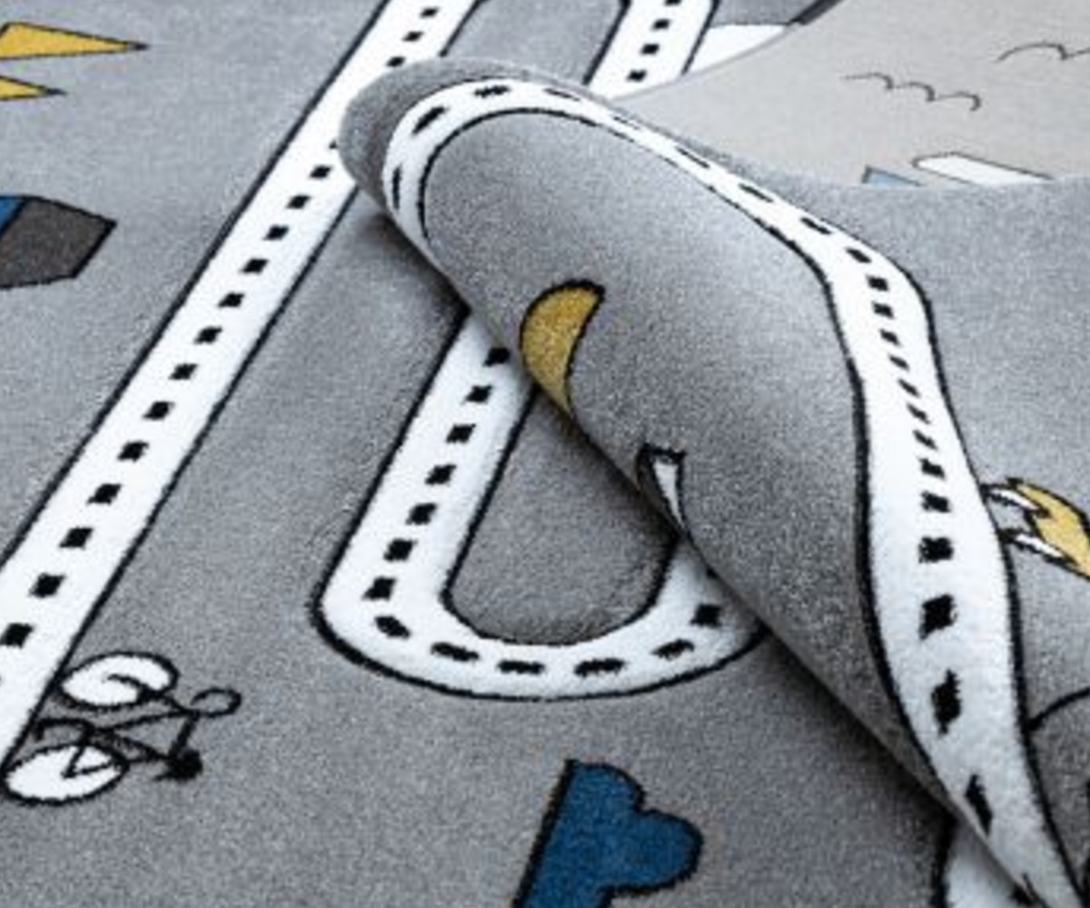 Detailne vaade Lastetoa autovaipe PETIT Tänavad, fookus pehmete materjalide peal
