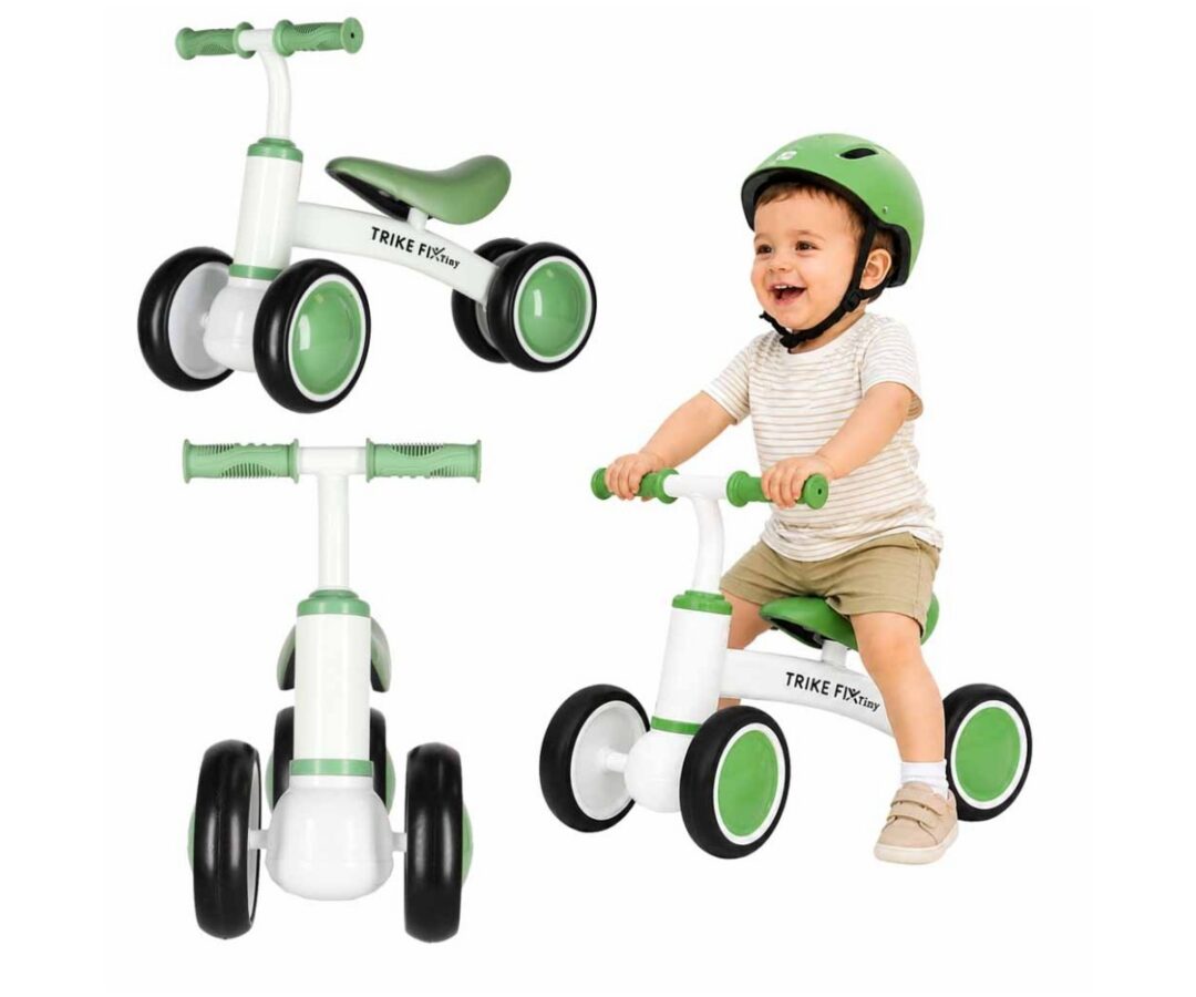 Tasakauluratas Trike Fix Tiny – valge-roheline (1,5+) mudel lapsel mängimas.