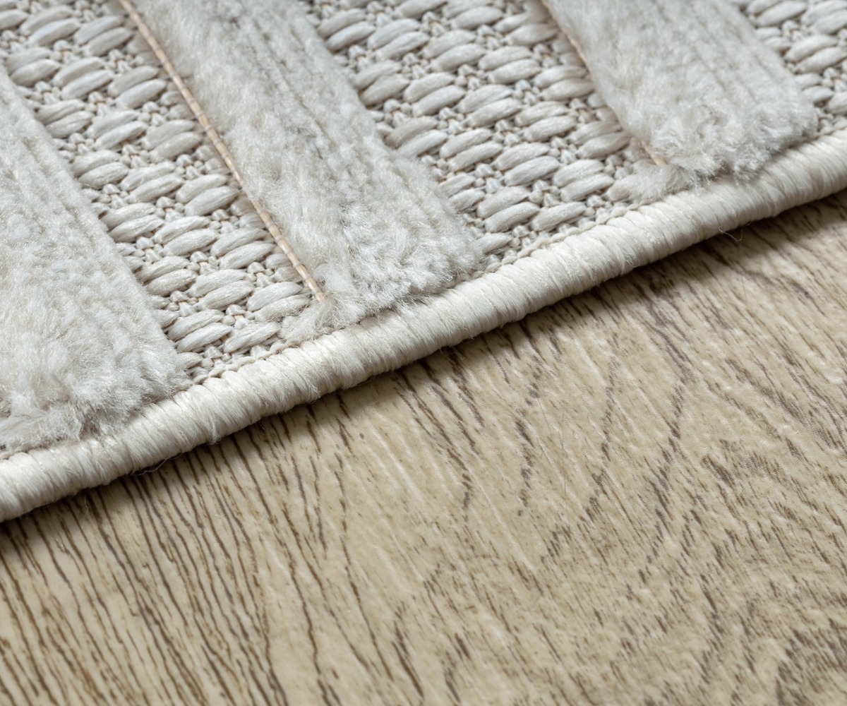 Detailne vaade beežist vaibast SANTO SISAL 58394 lainelise mustriga.