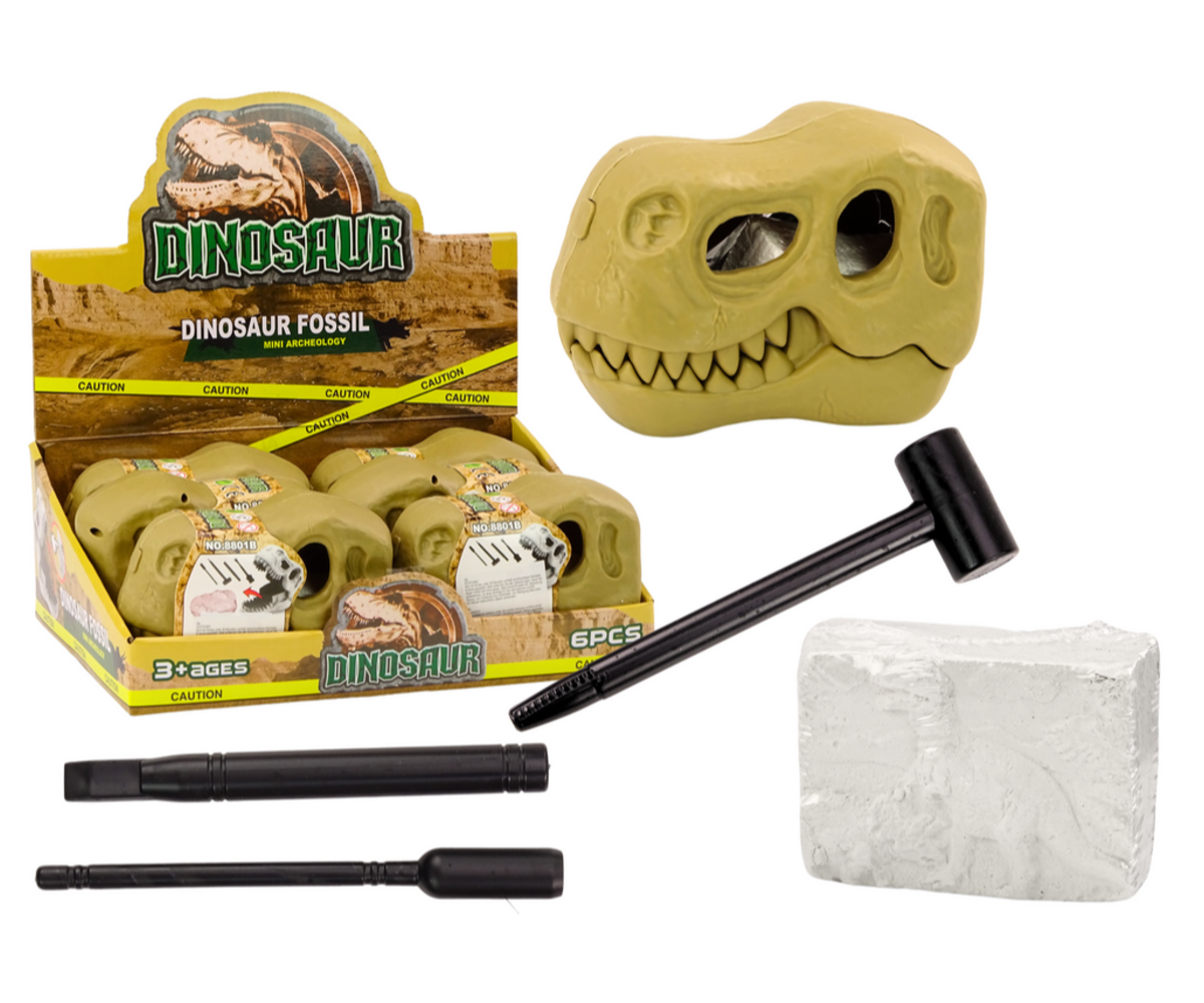 Dinosauruse väljakaevamiskomplekt fossiilidega – kolju, näidates erinevaid tööriistu ja fosse, sealhulgas kolju ja haamrit.