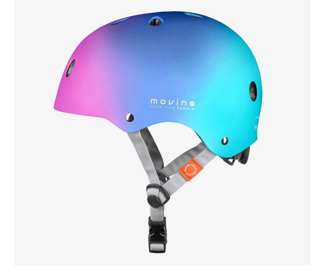 Movino Element laste kiiver S – vikerkaar (51–54cm) külgvaade, näidates selle värvikat disaini ja turvavöö süsteemi.