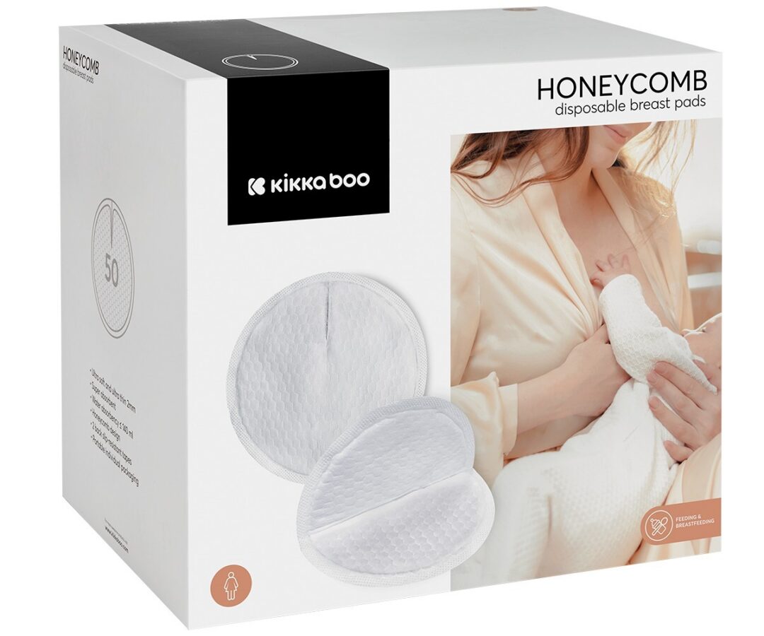 Ühekordsed rinnapadjad Honeycomb 50tk pakendil on illustratsioon rinnaga toitevast emast ja toote omadused.